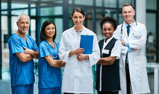 Doctor, nurse and portrait with arms crossed for teamwork together, professional or confidence. Men, woman and face for healthcare research or breakthrough collaboration, life insurance or support. - Photo, Image
