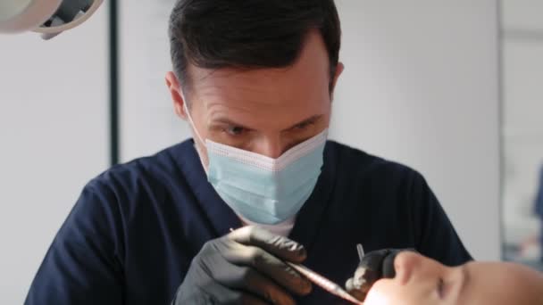 Dentist during routine visit with the patient - Footage, Video