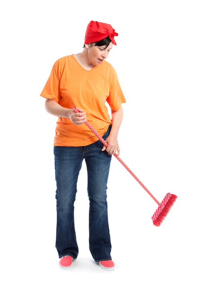 Middle aged woman dancing and cleaning - Foto, imagen