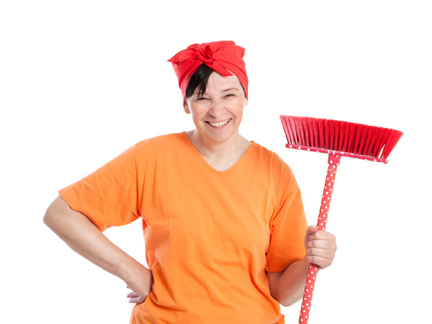 Middle aged woman with dotted broom - Photo, Image