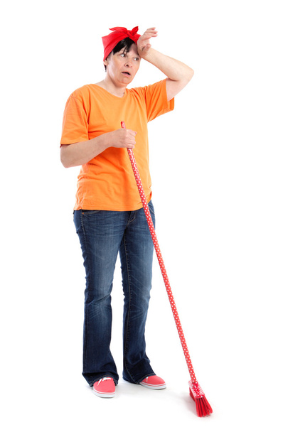 Tired middle-aged woman with dotted broom - Photo, Image