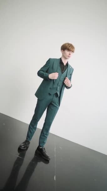 Young man in green suit posing for picture - Footage, Video