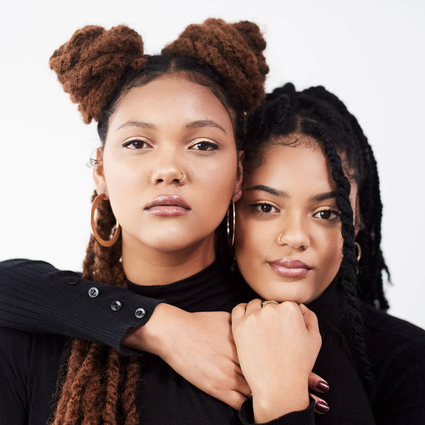 Attitude, portrait or serious sister black family in studio on white background for natural beauty. Braids, face and women with confident sibling people together for cosmetics, support or love. - Photo, Image