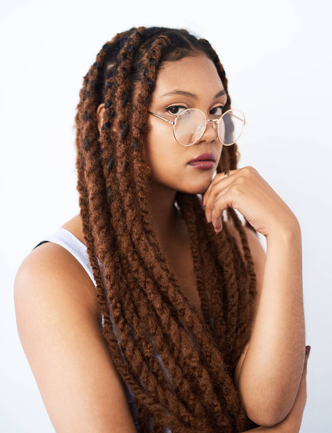 African woman, beauty and hairstyle in studio with portrait and glasses for smart, intelligent and confident. Young model, student or person with braids and vision for education on white background. - Photo, Image