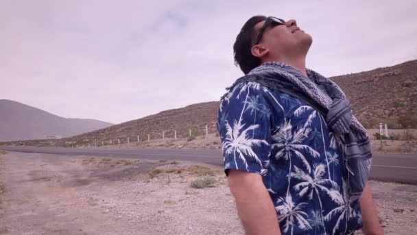 Caucasian man living the partial solar eclipse sighting experience wears glasses with solar protection filter to appreciate the natural phenomenon safely in Coahuila, Mexico state. - Footage, Video