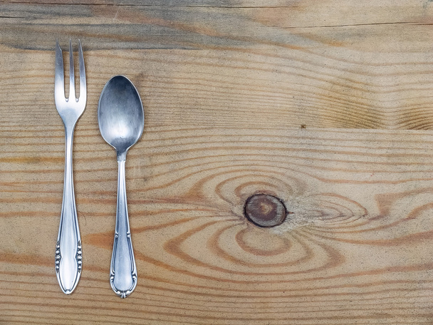 Silver spoon and a fork - Фото, изображение