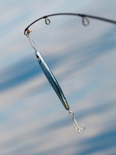 saltwater fishing - rod with wobbler and blue sea water - Photo, Image