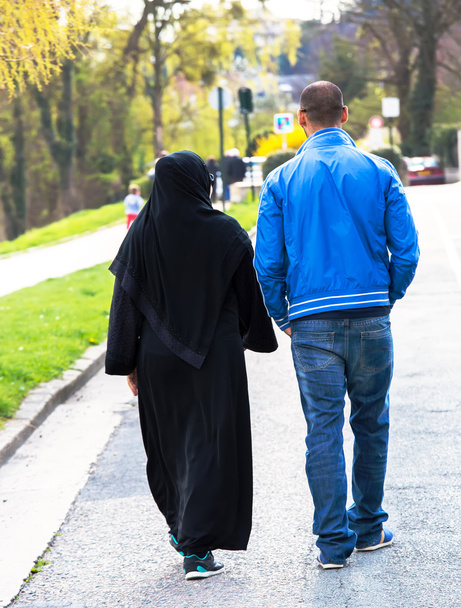 Young Muslim couple walking in the street - Photo, Image