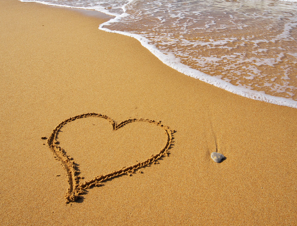 Heart on beach. - Фото, изображение