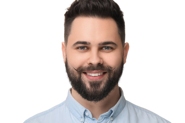 Portrait of happy young man with mustache on white background - Photo, Image