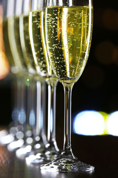 Glasses of champagne on bar background - Foto, imagen