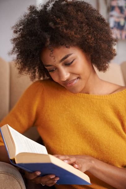 Woman, book and reading in university library or higher education or scholarship studying, literature or research. Female person, smile and textbook for school project or learning, academy or college. - Photo, Image