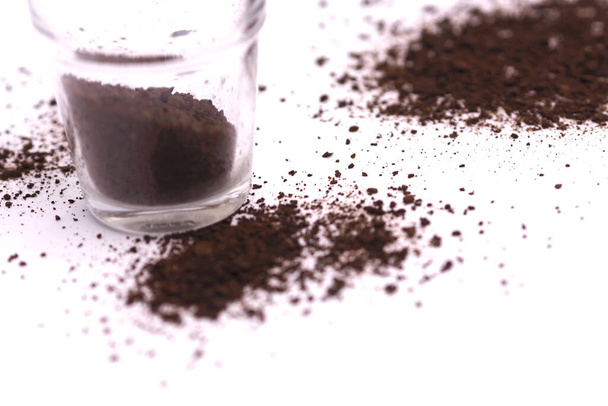 coffee grounds spilling from the glass - Photo, Image