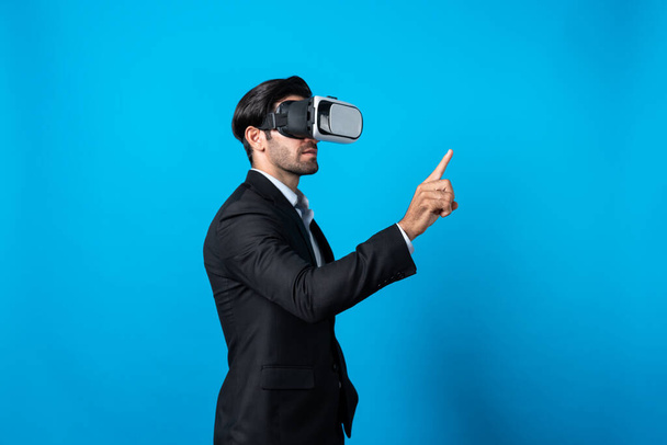 Project manager with virtual reality glasses looking at data analysis while analyzing and pointing data. Skilled business man using VR goggle and digital innovation while enter metaverse. Deviation. - Photo, Image