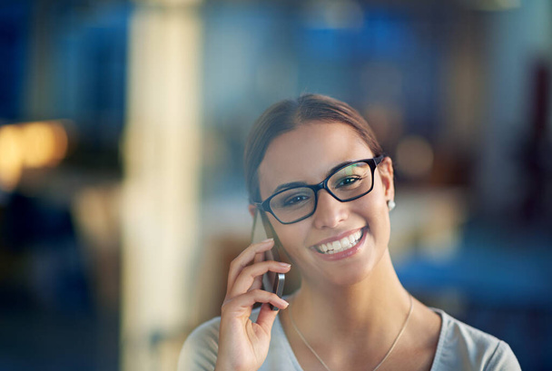 Person, smile and cellphone conversation in office for communication, sales and corporate deal. Business woman, happy and talking on mobile device for agreement, negotiation and job opportunity. - Photo, Image