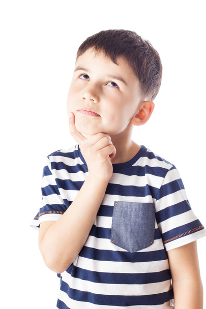 Thoughtful boy with finger on chin - 写真・画像