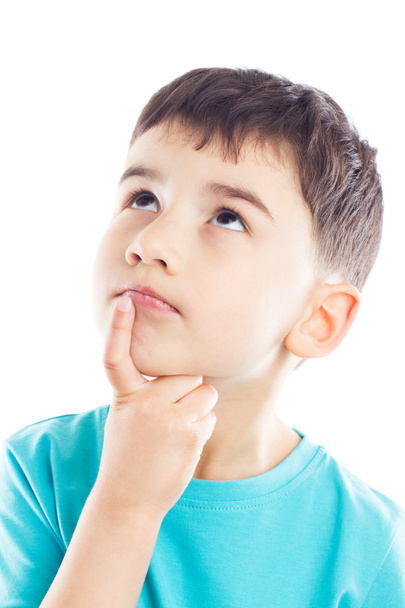Thoughtful boy with finger on chin - Photo, image