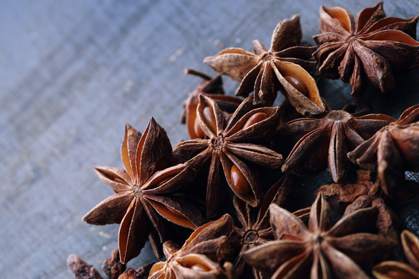 Anise star macro. Plant, agriculture, spice. Ingredient for aniseed alcohol: raki, ouzo, arak, sambuka. Natural, organic flavor badian closeup - Fotó, kép