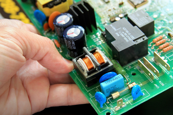 technician with a circuit board - Photo, Image