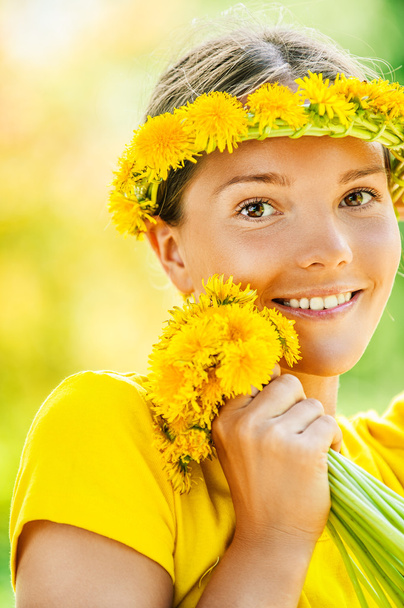 young woman in with bouquet of dandelions - Photo, Image