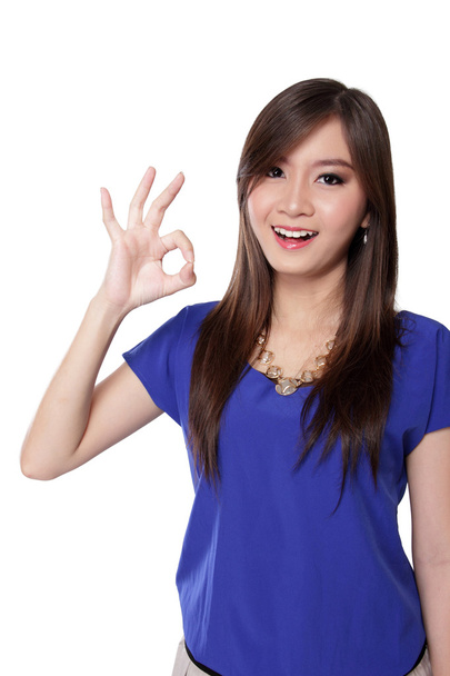 Happy Asian girl making okay hand gestures, isolated on white - Valokuva, kuva