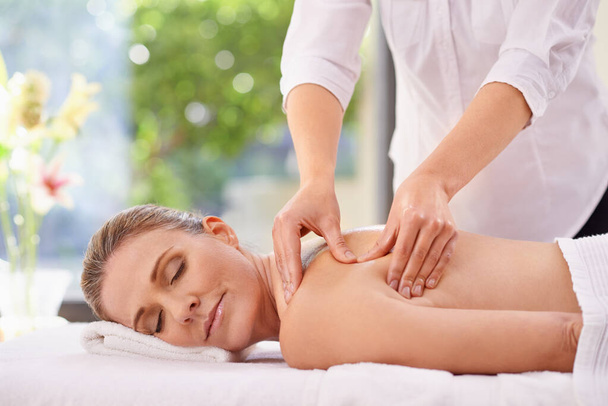 Woman, hands and spa massage for holiday treatment or relax stress relief at zen resort, calm or vacation. Female person, eyes closed and comfortable break or healthy carefree, pamper or luxurious. - Photo, Image
