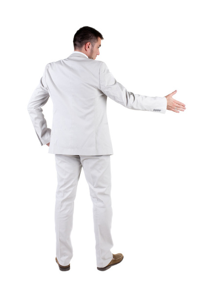 Businessman extending hand to shake. Rear view. - Photo, Image