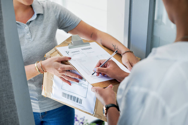 Person, signature and package delivery in home front door for online shopping, distribution or returns. Customer, ecommerce and logistics paperwork for export box or supply chain, courier or retail. - Photo, Image