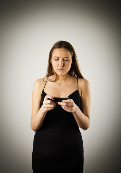 Young woman with telephone - Φωτογραφία, εικόνα