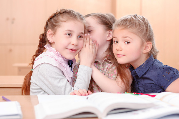 Girls with opened books in classroom - Φωτογραφία, εικόνα