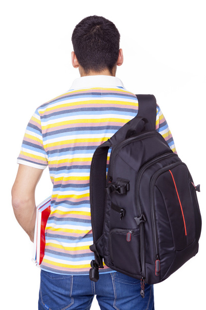 Back view of male student standing - Foto, Bild