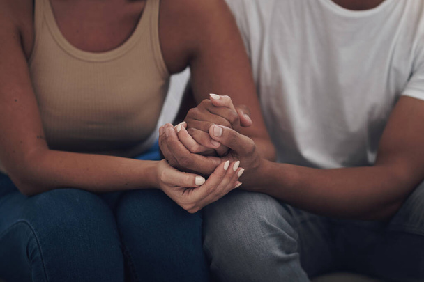Couple, love and holding hands for trust, care and solidarity or romance with respect. Compassion, partnership and support for bad news in relationship, grief and marriage therapy for hope and unity. - Photo, Image
