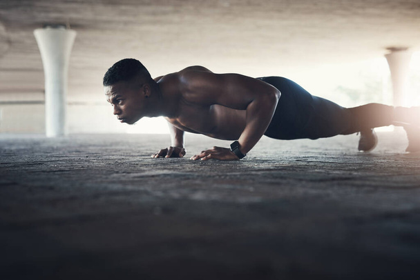 Black man, fitness and cardio with push ups for exercise, muscle training and endurance in Atlanta. Bodybuilder, serious and resilience in workout with energy for body strength, power and self care. - Photo, Image