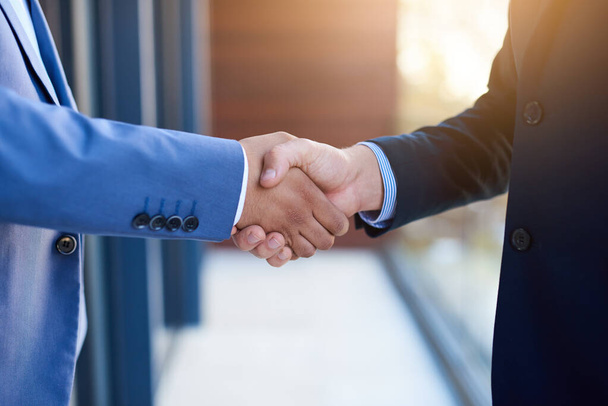 Business people, office building and handshake for job interview, welcome and onboarding offer. thank you, support and b2b men shaking hands on balcony for recruitment, negotiation and contract deal. - Photo, Image