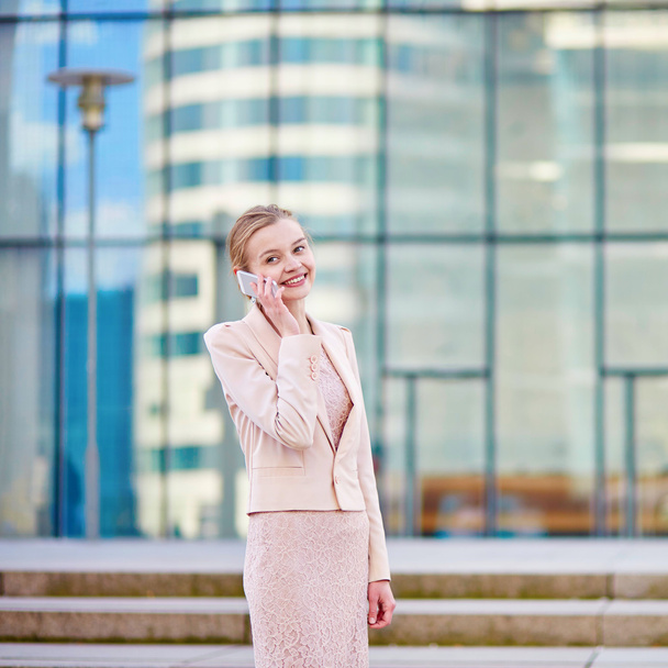 Young confident business woman using phone - Fotó, kép