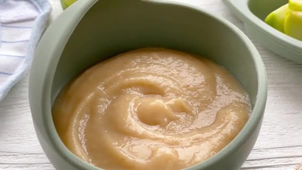 Healthy baby food in bowl. Bowl with delicious puree.   - Footage, Video