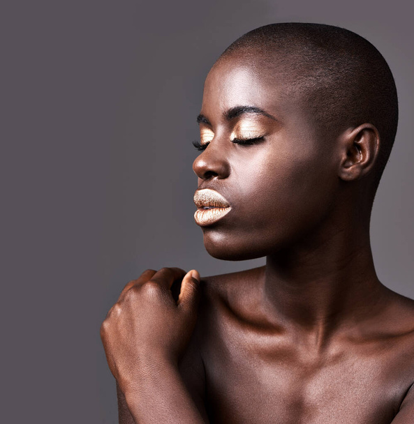 Face, mockup and closeup of black woman for makeup, beauty and cosmetics isolated on gray background. Person, African lady and eyeshadow with lipstick in studio for skin care, cleansing or treatment. - Photo, Image