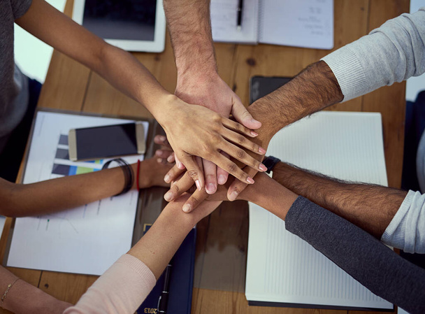 Hands stack, group and support at desk with documents, diversity and ux design with motivation for goals. People, teamwork and cheers with solidarity, planning and link with synergy at workplace. - Photo, Image