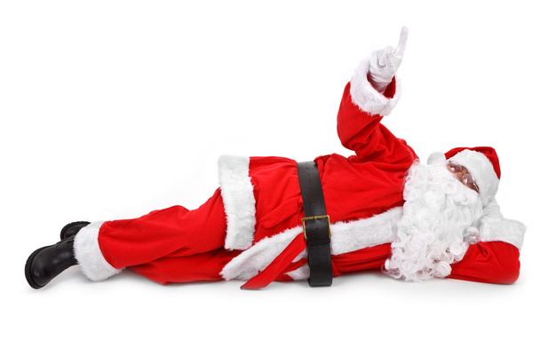 Santa is pointing his finger at an object - Valokuva, kuva