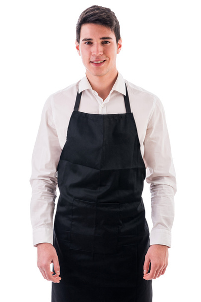 Young chef or waiter wearing black apron - Foto, imagen
