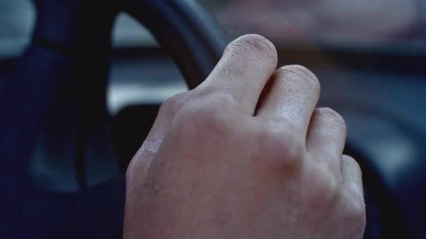 Close up of a guy hand on car steering wheel. Stock. A man holds his car steering wheel, driving a car - Footage, Video