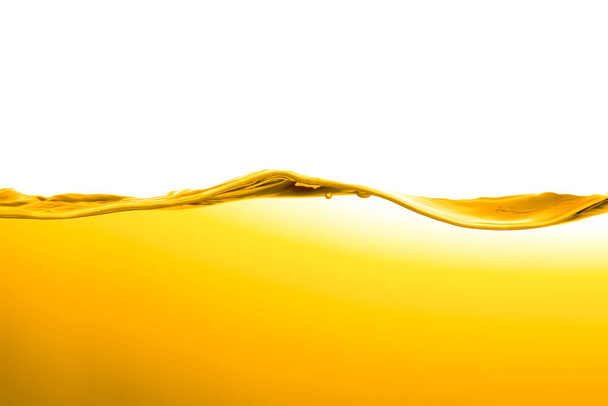 orange juice is isolated on white background. healthy fresh drink and natural waves. close up view. - Fotó, kép