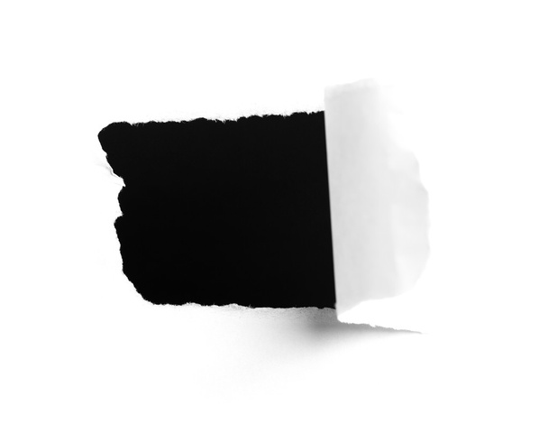 Fechar-se de um buraco escuro em papel branco
  - Foto, Imagem