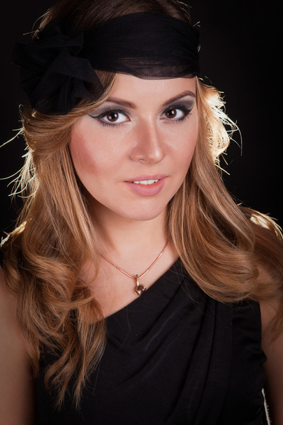 Young beautiful woman in black hat - Fotó, kép