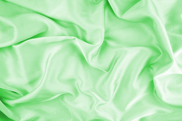 Textura de tecido chiffon verde para fundo. Tecido de seda. Foco seletivo. - Foto, Imagem