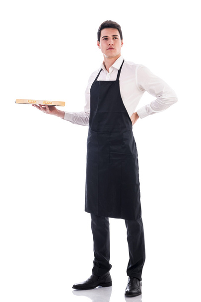 Attractive young chef or waiter holding pizza box - Foto, imagen