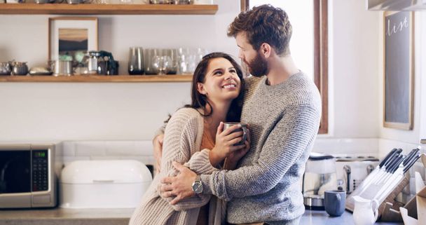 Couple, people and happy with hug in kitchen, together and support for unity. Relationship, happy and bonding for romance with commitment for care, help and trust as soulmate for love at home. - Photo, Image