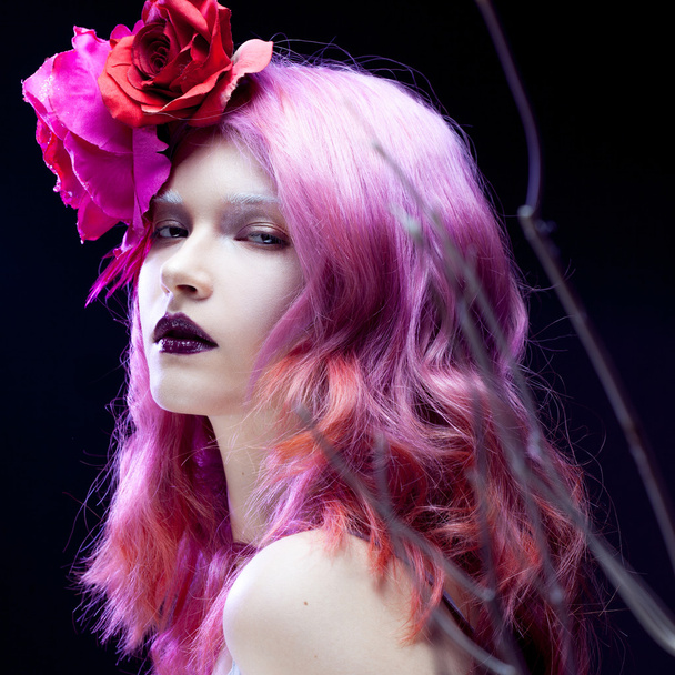 beautiful girl with pink hair,  among the branches - Photo, Image