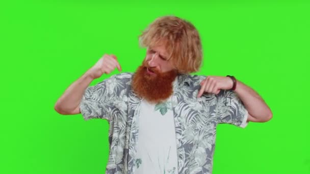 I am the best, choose me. Young happy man feeling very proud pointing herself, looking self-confident, overjoyed by success, making choice. Redhead adult guy isolated on green chroma key background - Footage, Video