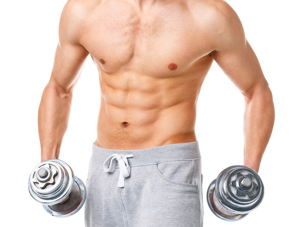 Athletic man with dumbbells on the white - Foto, imagen